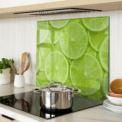 Tábua para cozinha Fatias de limão em um fundo verde