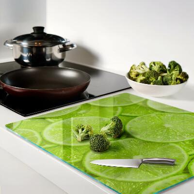 Tábua para cozinha Fatias de limão em um fundo verde
