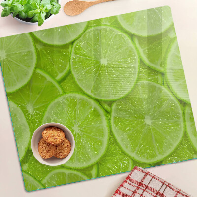 Tábua para cozinha Fatias de limão em um fundo verde