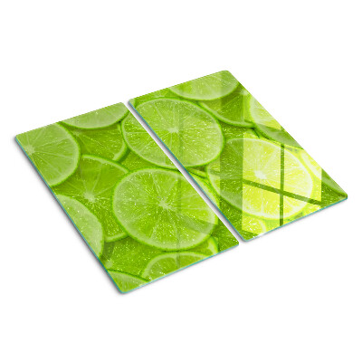 Tábua para cozinha Fatias de limão em um fundo verde