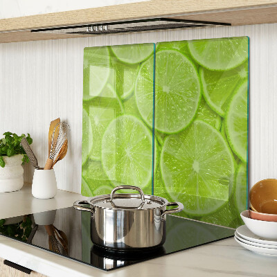 Tábua para cozinha Fatias de limão em um fundo verde