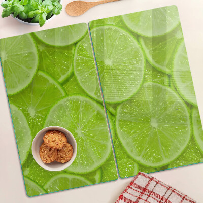 Tábua para cozinha Fatias de limão em um fundo verde