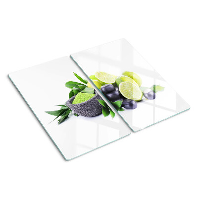 Tábua para corte Limões e uvas em um fundo verde