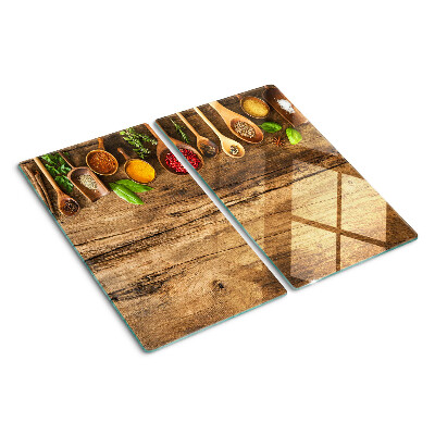 Tábua para corte Especiarias e ervas em um fundo de madeira