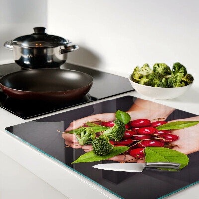 Tábua para cozinha Cerejas vermelhas nas mãos