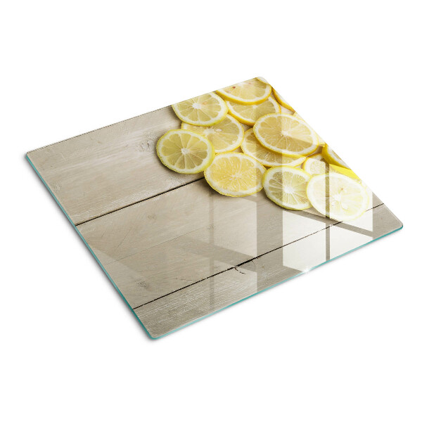 Tábua para cozinha Fatias de limão em um fundo de madeira