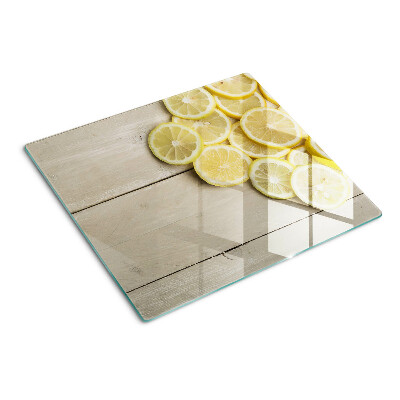 Tábua para cozinha Fatias de limão em um fundo de madeira
