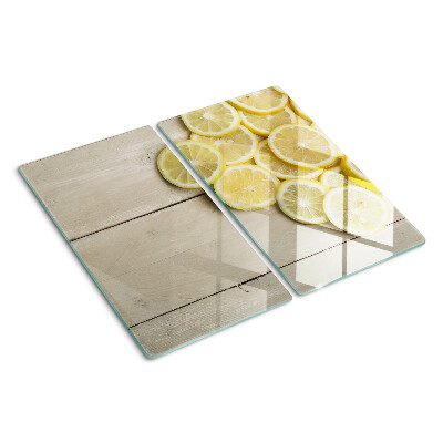 Tábua para cozinha Fatias de limão em um fundo de madeira