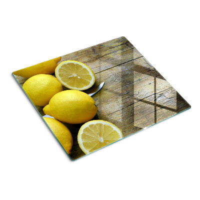 Tábua para cozinha Limões em um fundo de madeira