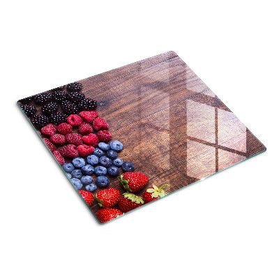 Tábua para cozinha Frutas da floresta em um fundo de madeira