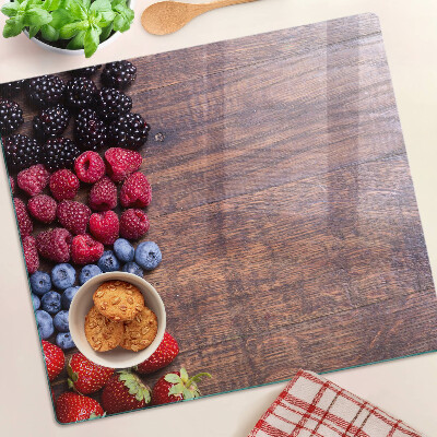 Tábua para cozinha Frutas da floresta em um fundo de madeira