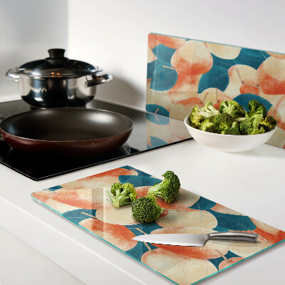 Tábua para cozinha Pêssegos contra o fundo de folhas