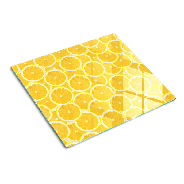 Tábua para corte Fatias de limão em um fundo amarelo