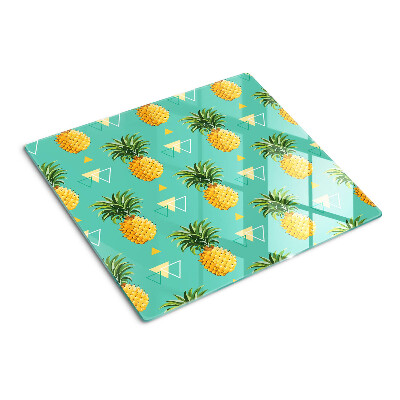 Tábua para corte Abacaxis em um fundo turquesa