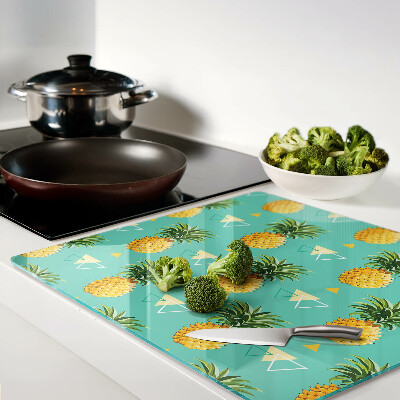 Tábua para corte Abacaxis em um fundo turquesa