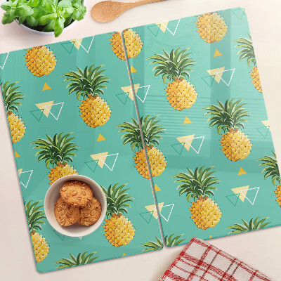 Tábua para corte Abacaxis em um fundo turquesa