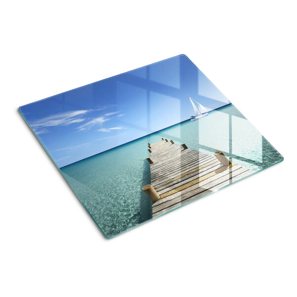 Tábua para corte Cais sobre o mar turquesa