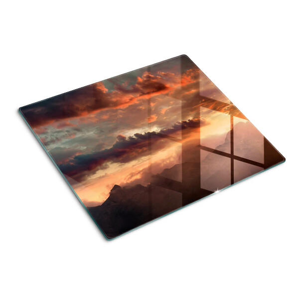 Tábua para corte Pôr do sol sobre as montanhas