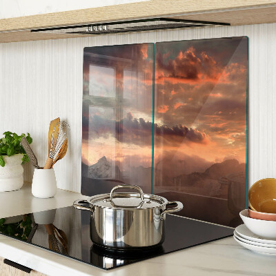 Tábua para corte Pôr do sol sobre as montanhas