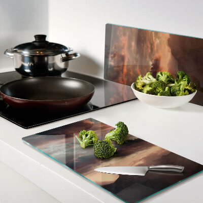 Tábua para corte Pôr do sol sobre as montanhas