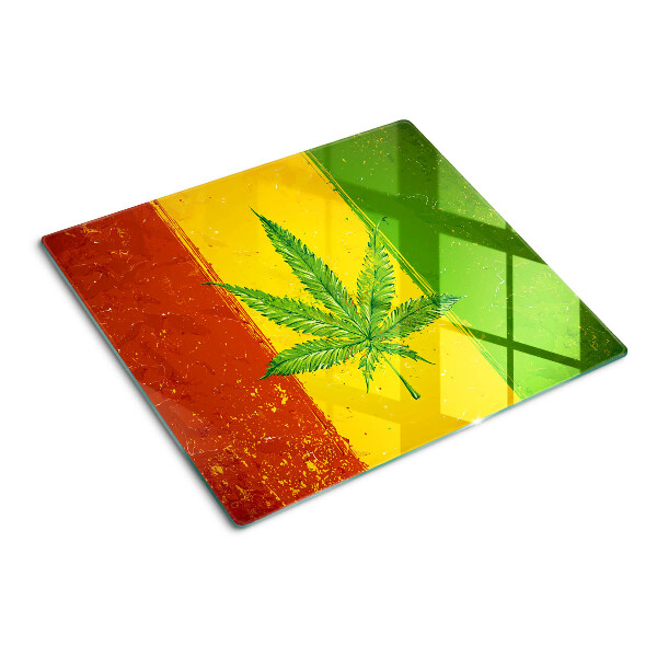 Tábua para cozinha Folha de cannabis em um fundo colorido