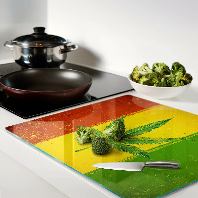 Tábua para cozinha Folha de cannabis em um fundo colorido