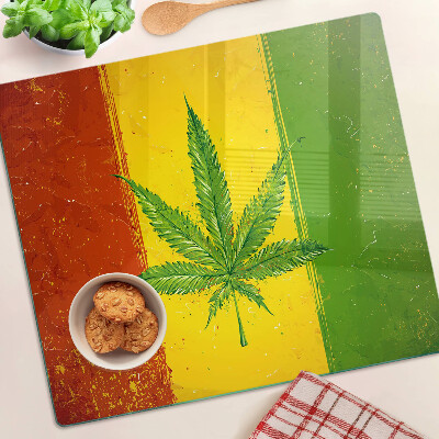 Tábua para cozinha Folha de cannabis em um fundo colorido