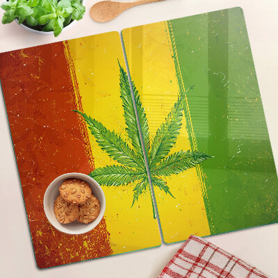 Tábua para cozinha Folha de cannabis em um fundo colorido