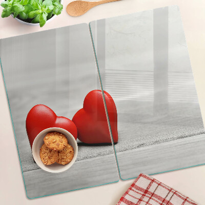 Tábua para cozinha Corações vermelhos em um fundo de madeira