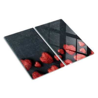 Tábua para corte Corações vermelhos em um fundo escuro