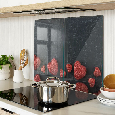 Tábua para corte Corações vermelhos em um fundo escuro