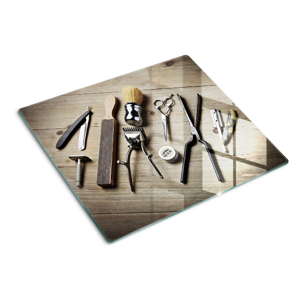 Tábua para cozinha Ferramentas de cabeleireiro em um fundo de madeira