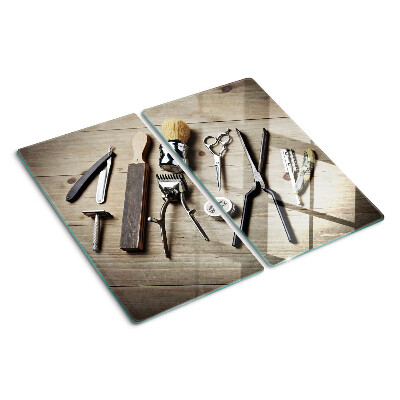 Tábua para cozinha Ferramentas de cabeleireiro em um fundo de madeira