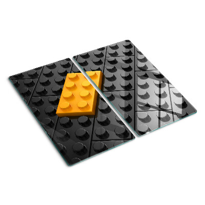 Tábua para corte Peças de LEGO em um fundo preto