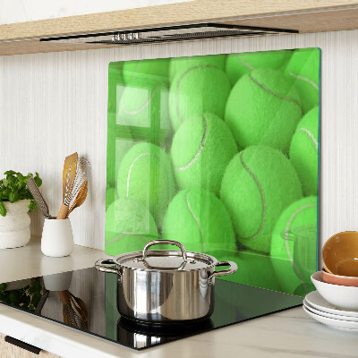 Tábua para cozinha Bolas de tênis em um fundo verde