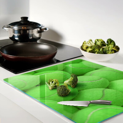Tábua para cozinha Bolas de tênis em um fundo verde