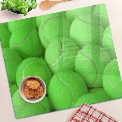 Tábua para cozinha Bolas de tênis em um fundo verde