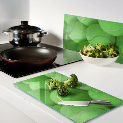 Tábua para cozinha Bolas de tênis em um fundo verde