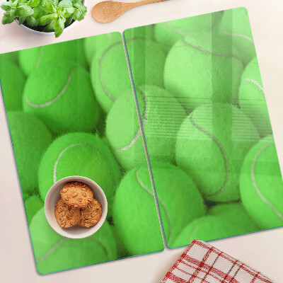 Tábua para cozinha Bolas de tênis em um fundo verde