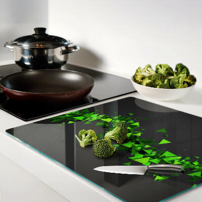 Tábua para corte Triângulos verdes em um fundo preto