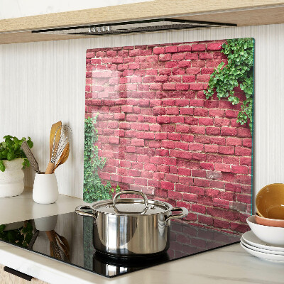 Tábua para corte Parede de tijolos com vegetação