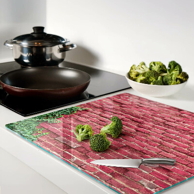 Tábua para corte Parede de tijolos com vegetação