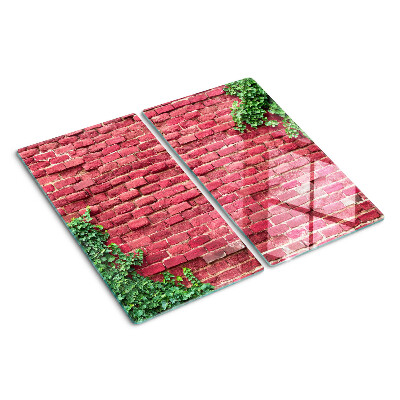 Tábua para corte Parede de tijolos com vegetação