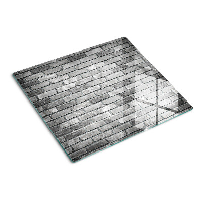 Tábua para corte Parede de tijolos em tons de cinza