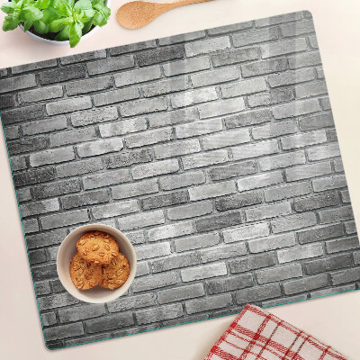 Tábua para corte Parede de tijolos em tons de cinza