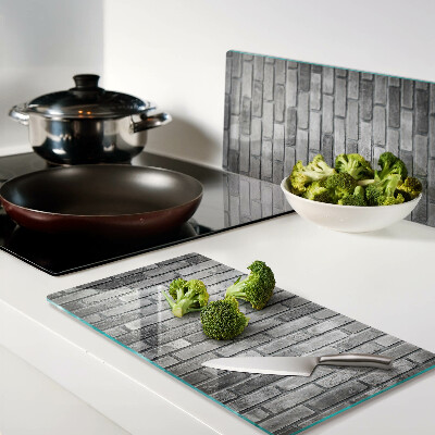 Tábua para corte Parede de tijolos em tons de cinza