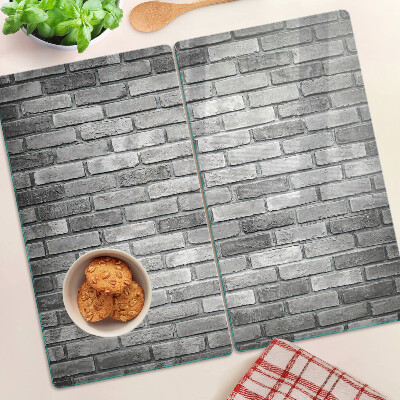 Tábua para corte Parede de tijolos em tons de cinza