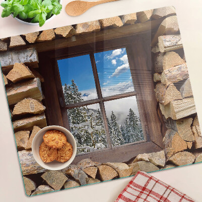 Tábua para corte Vista de uma paisagem de inverno através da janela