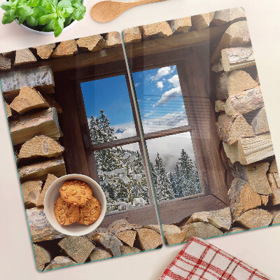 Tábua para corte Vista de uma paisagem de inverno através da janela