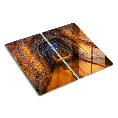 Tábua para cozinha Um túnel em uma caverna com iluminação